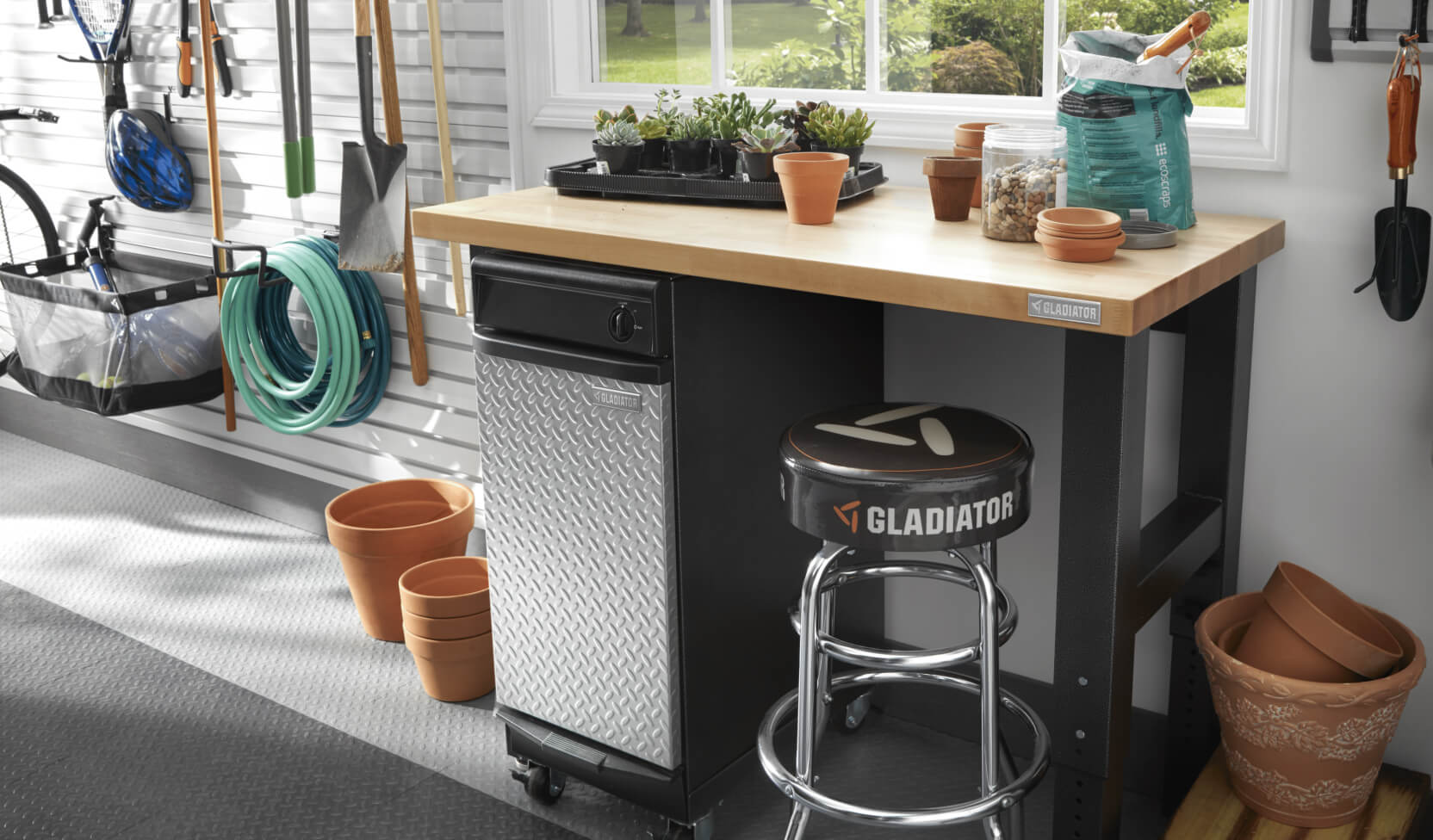 A Gladiator® workbench with gardening supplies